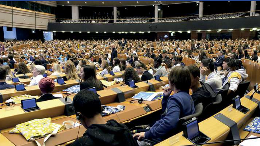 Young people at the European Parliament, representing EYCIA's mission
